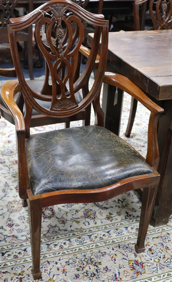 A set of eight shield-back Hepplewhite style chairs, six plus two carvers